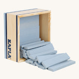 KAPLA 40 Grey Wooden Building Planks spilling out of their box which has been placed in it's side with the lid taken off.
