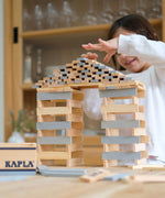 A build created using natural and grey coloured Kapla wooden planks.