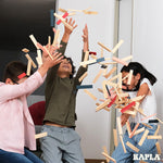 Kapla plastic-free wooden toy blocks stacked into the shape of a boat on a white background