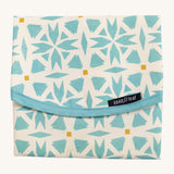 Keep Leaf food wrap in geo design. A cream colour organic cotton wrap for food with blue geo shapes printed all over and light pink trim. Features a velcro lid for easy fastening