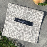 A close up of the organic cotton mesh Keep Leaf large baggie outside on a blanket.