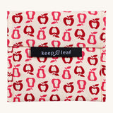 Keep Leaf large baggie in new fruit design. A cream colour organic cotton pouch for food with red apples and pears outlines printed all over. Features a velcro lid for easy fastening