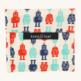 Keep Leaf large baggie in robot design. A cream colour organic cotton pouch for food with playful blue and red robots printed all over. Features a velcro lid for easy fastening