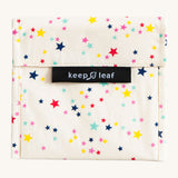 Keep Leaf large baggie in stars design. A cream colour organic cotton pouch for food with multi coloured stars printed all over. Features a velcro lid for easy fastening