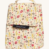 Keep Leaf insulated lunchbag in bloom design. A cream colour organic cotton bag  with light cute flowers printed all over. Features a handle for carrying and a velcro lid.