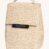 Keep Leaf insulated lunchbag in mesh design. A cream colour organic cotton bag  with grey abstract mesh lines printed all over. Features a handle for carrying and a velcro lid.