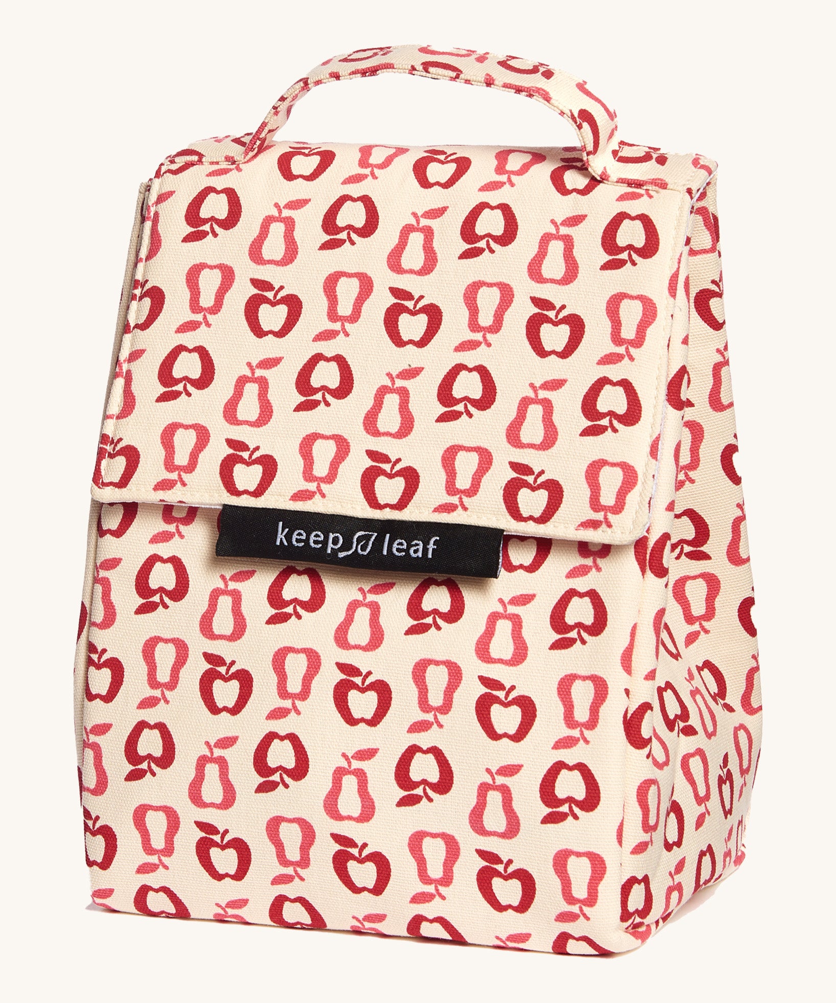 Keep Leaf insulated lunchbag in new fruit design. A cream colour organic cotton bag  with red apples and pears outlines printed all over. Features a handle for carrying and a velcro lid.