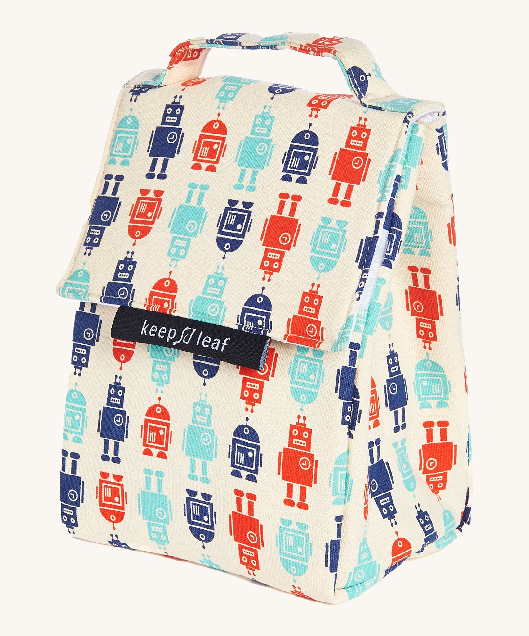 Keep Leaf insulated lunchbag in robot design. A cream colour organic cotton bag  with red and blue robots printed all over. Features a handle for carrying and a velcro lid.