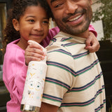 A child getting a piggy back teh child is holding an Owlet print Kid Kanteen 12oz Insulated Flip Seal Sport Cap Bottle.