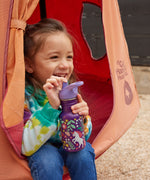 A child drinking from a purple coloured Leaping Unicorns print Kid Kanteen 12oz Narrow Flip Seal Sport Cap Bottle.