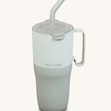 Klean Kanteen 26oz barely blue rise insulated stainless steel tumbler available at Babipur. A pale blue and grey with a matching flip lid. Features a handle on the side and matching straw.