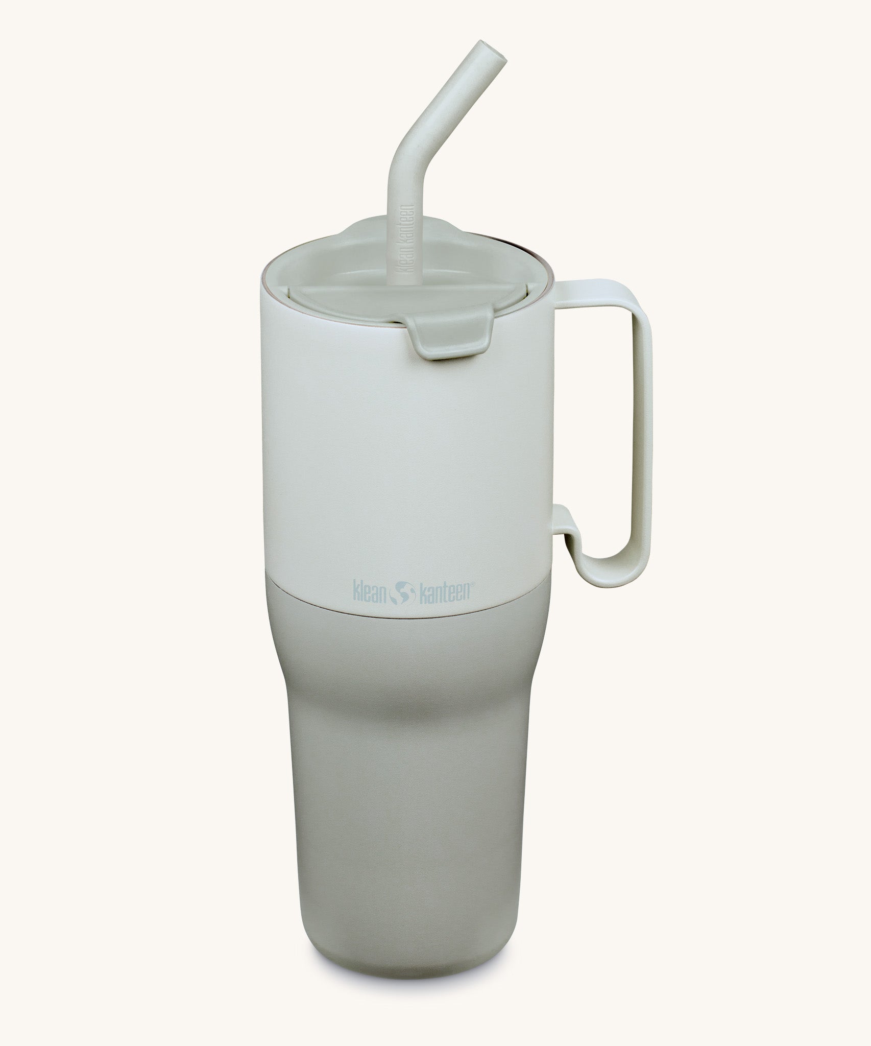 Klean Kanteen 36oz barely blue rise insulated stainless steel tumbler available at Babipur. A pale blue and grey with a matching flip lid. Features a handle on the side and matching straw.