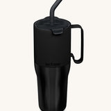 Klean Kanteen 36oz black rise insulated stainless steel tumbler available at Babipur. A black tumbler with a mat finish on the top half and glossy finish on the bottom half. Features a matching flip lid a handle on the side and matching straw.