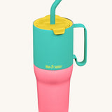 Klean Kanteen 36oz turquoise kaleidoscope rise insulated stainless steel tumbler available at Babipur. A turquoise and pink tumbler with a yellow flip lid. Features a turquoise handle on the side and matching straw.