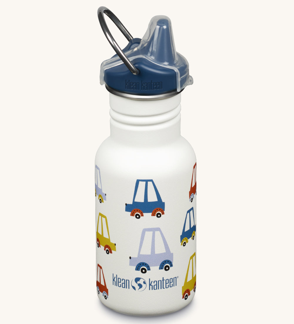 A Kid Kanteen 12oz Narrow Sippy reusable stainless steel water Bottle. The bottle is white with a multi coloured car print, the sippy lid is navy blue.