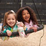 Two children on a circular swing, one child has a unicorn print Kid Kanteen 12oz Narrow Sippy Bottle.