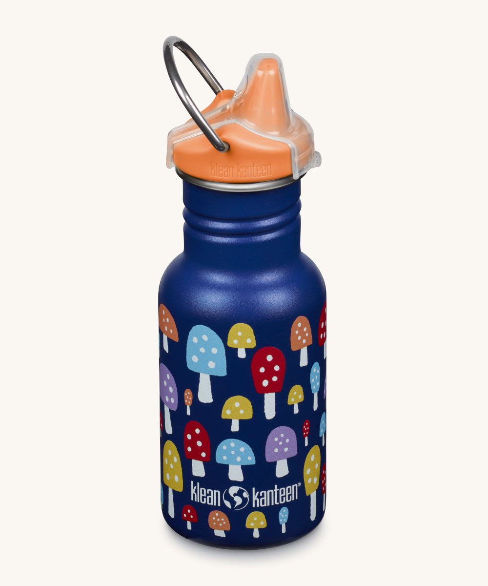 A Kid Kanteen 12oz Narrow Sippy reusable stainless steel water Bottle. The bottle is blue with a multi coloured mushroom print, the sippy lid is orange.