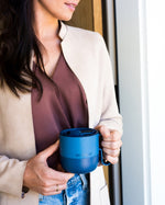 Close up of a Klean Kanteen stainless steel insulated mug in the Tofu colour