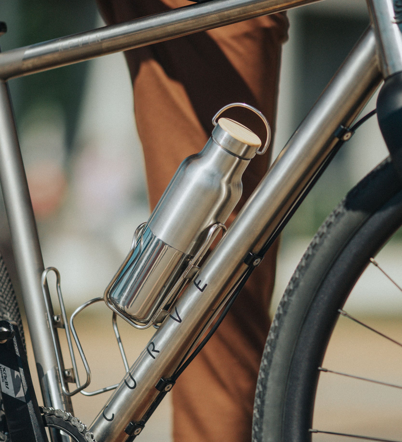 A klean Kanteen 16oz reflect stainless steel Klean Kanteen insulated bottle in bottle holder on a bike.