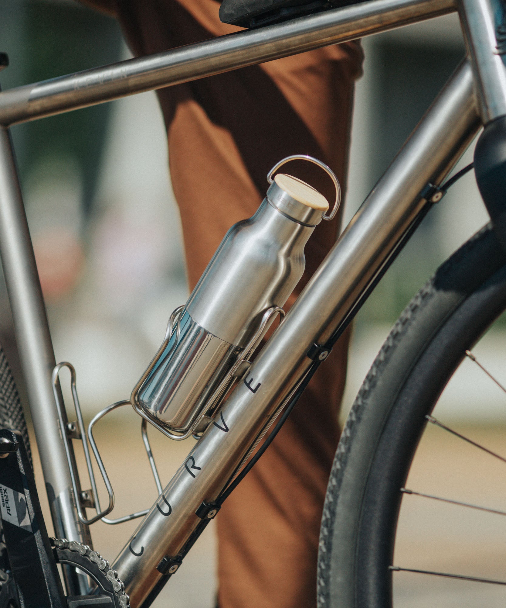 A klean Kanteen 16oz reflect stainless steel Klean Kanteen insulated bottle in bottle holder on a bike.