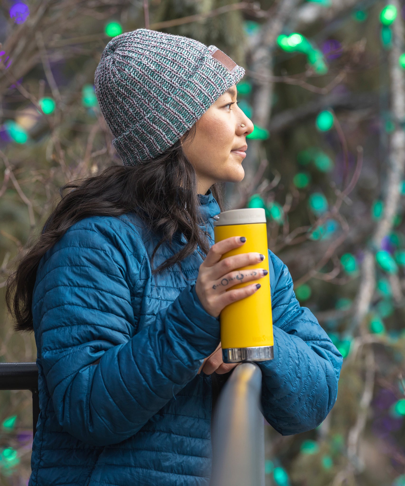 A person holding a Klean Kanteen 16oz TKWide in aSunset yellow colour with taupe Cafe cap.