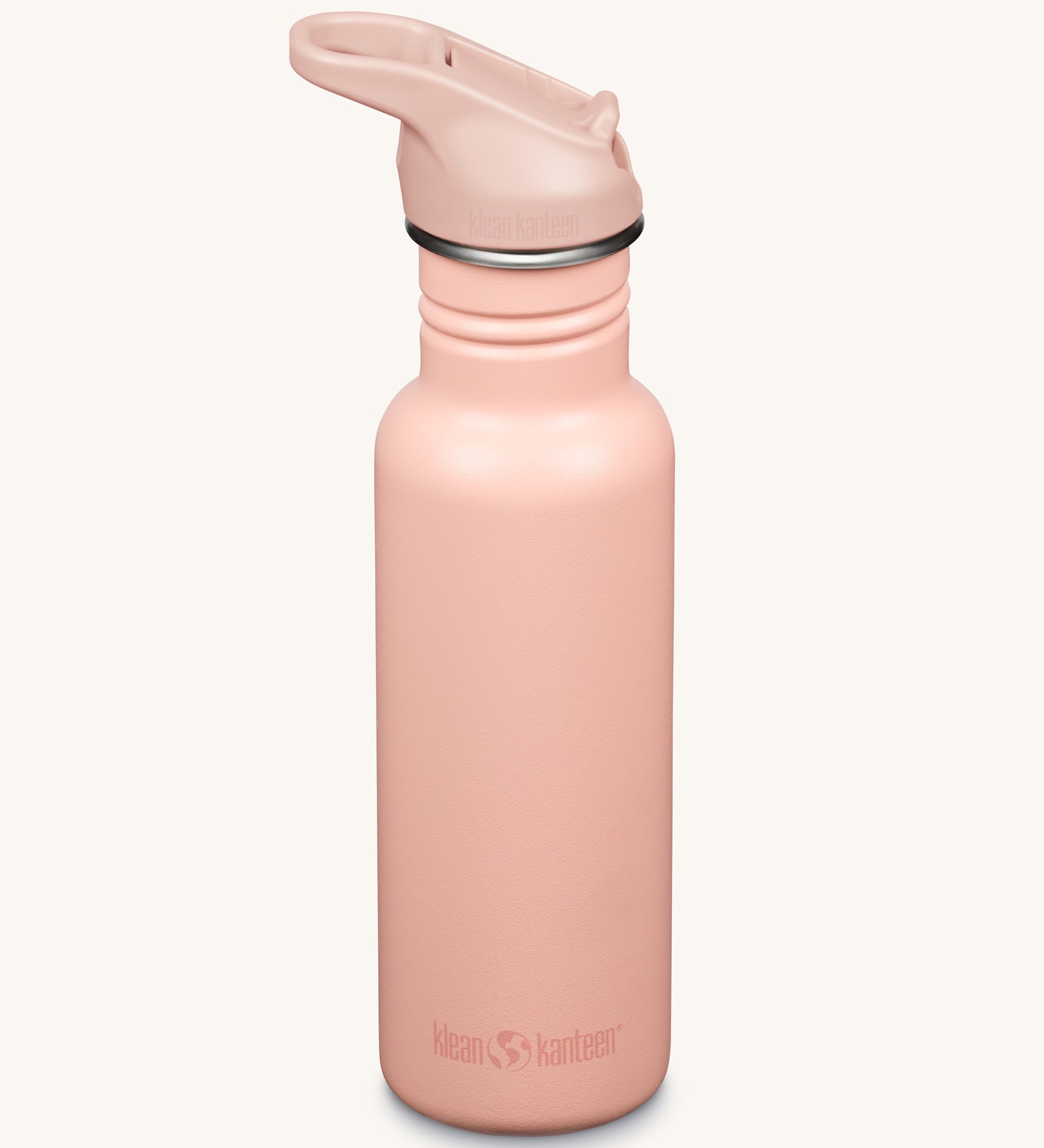 A Klean Kanteen 18oz Classic Narrow Leakproof Flip Seal Sports Cap Reusable Stainless Steel Water Bottle in a light pink peach parfait colour.