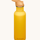 A Sunset yellow coloured Klean Kanteen 27oz Classic Narrow Leakproof Flip Seal Sports Cap Reusable Stainless Steel Water Bottle.