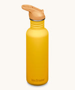 A Sunset yellow coloured Klean Kanteen 27oz Classic Narrow Leakproof Flip Seal Sports Cap Reusable Stainless Steel Water Bottle.