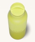 A close up of the Klean Kanteen 20oz Classic rise acacia insulated classic reusable steel water bottle showing the handle detail on the yellow loop cap