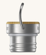 A close up of the Klean Kanteen bamboo stainless steel loop cap for the rise reflect insulated bottles showing the handle and thread detail
