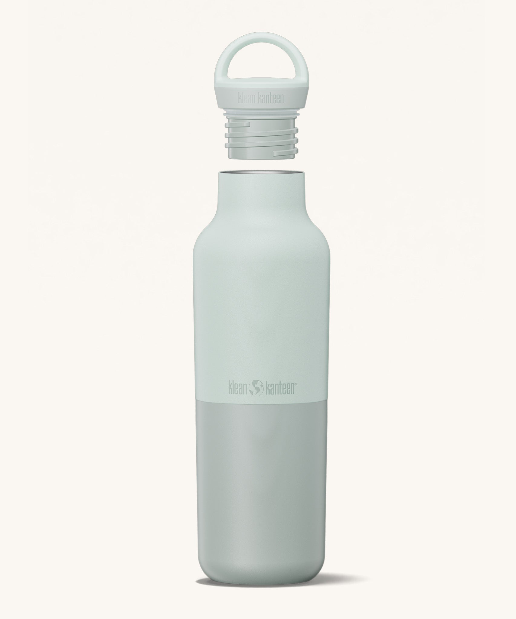 A Klean Kanteen 20oz rise insulated Reusable Stainless Steel Water Bottle in a barely blue colour that's split in a light and dark shade. Features a matching loop cap with a thread and handle for easy carrying