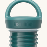 A close up of the Klean Kanteen Brittany blue loop cap that fits on the 20oz classic rise bottle available at Babipur showing the thread and loop hand detail