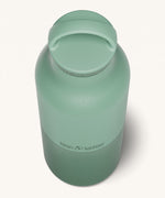 A close up of the Klean Kanteen 20oz Classic rise iceberg insulated classic reusable steel water bottle showing the handle detail on the green loop cap