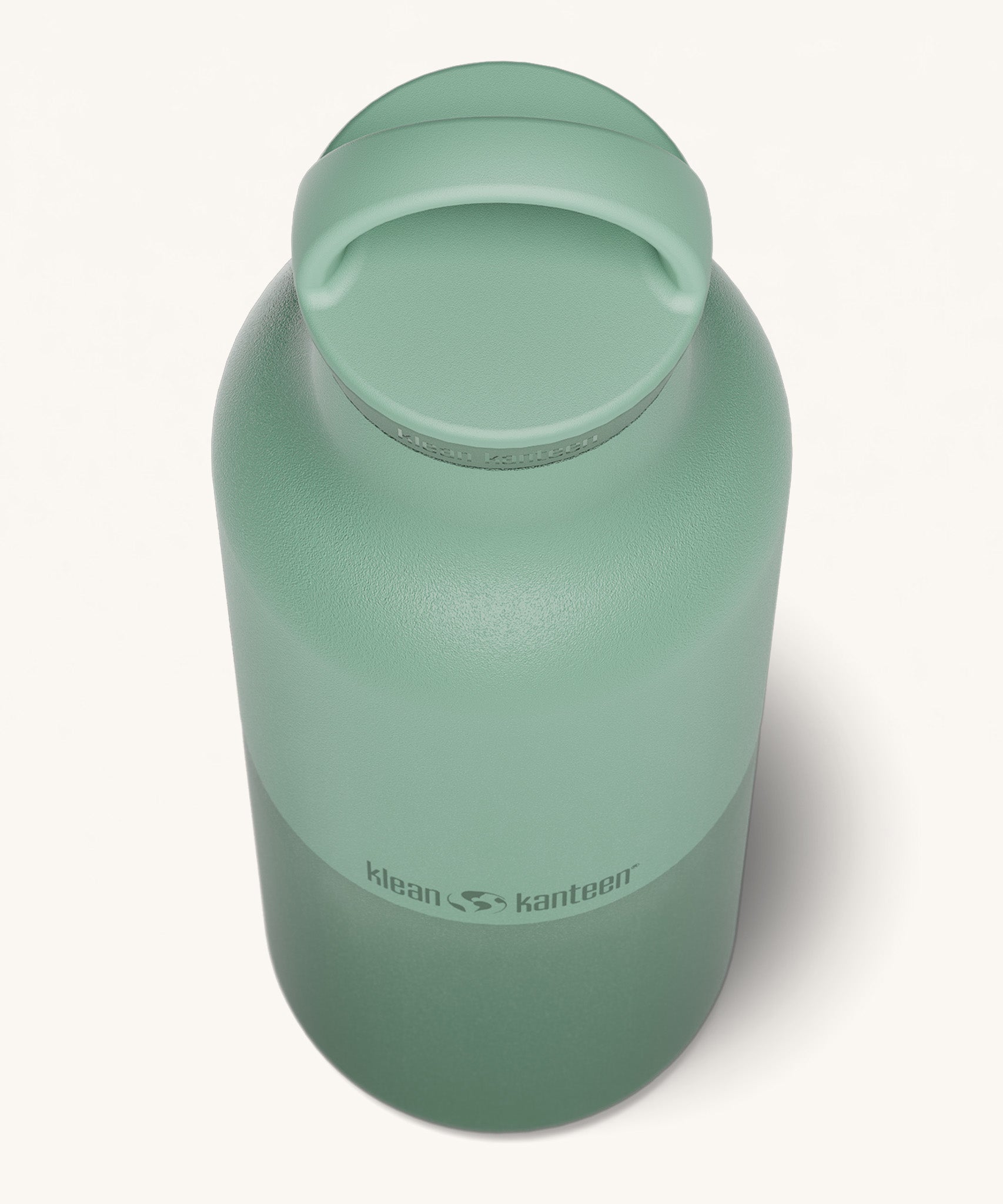 A close up of the Klean Kanteen 20oz Classic rise iceberg insulated classic reusable steel water bottle showing the handle detail on the green loop cap