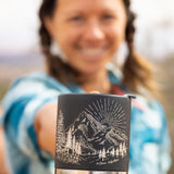 An adult holding the Klean Kanteen 12oz Insulated Mug in Black Mountain
