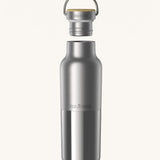 Klean Kanteen 16oz reusable stainless steel reflect water bottle available at Babipur with a smooth top half finish and a glossy bottom half finish. Features a handy bamboo loop cap with a thread