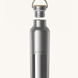 Klean Kanteen 20oz reusable stainless steel reflect water bottle available at Babipur with a smooth top half finish and a glossy bottom half finish. Features a handy bamboo loop cap with a thread