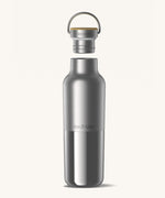 Klean Kanteen 20oz reusable stainless steel reflect water bottle available at Babipur with a smooth top half finish and a glossy bottom half finish. Features a handy bamboo loop cap with a thread