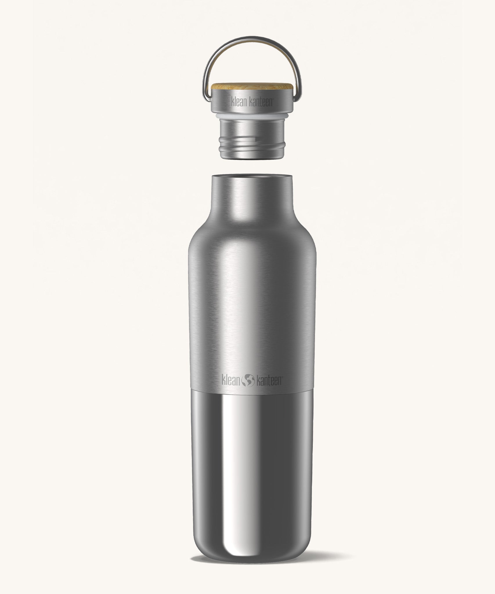 Klean Kanteen 20oz reusable stainless steel reflect water bottle available at Babipur with a smooth top half finish and a glossy bottom half finish. Features a handy bamboo loop cap with a thread