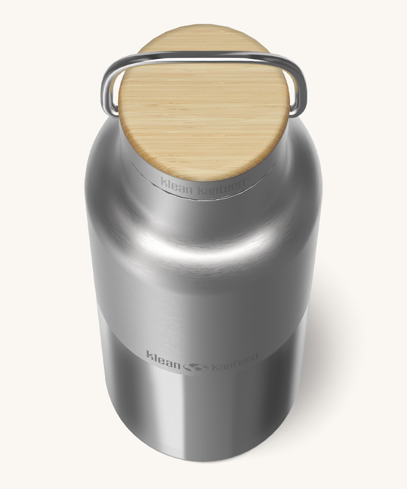 A close up of the Klean Kanteen 16oz reusable stainless steel reflect water bottle available at Babipur showing the bamboo detail on top of the loop cap.