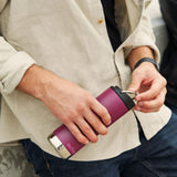 Close up of man holding the Klean Kanteen 16oz tkwide reusable metal bottle