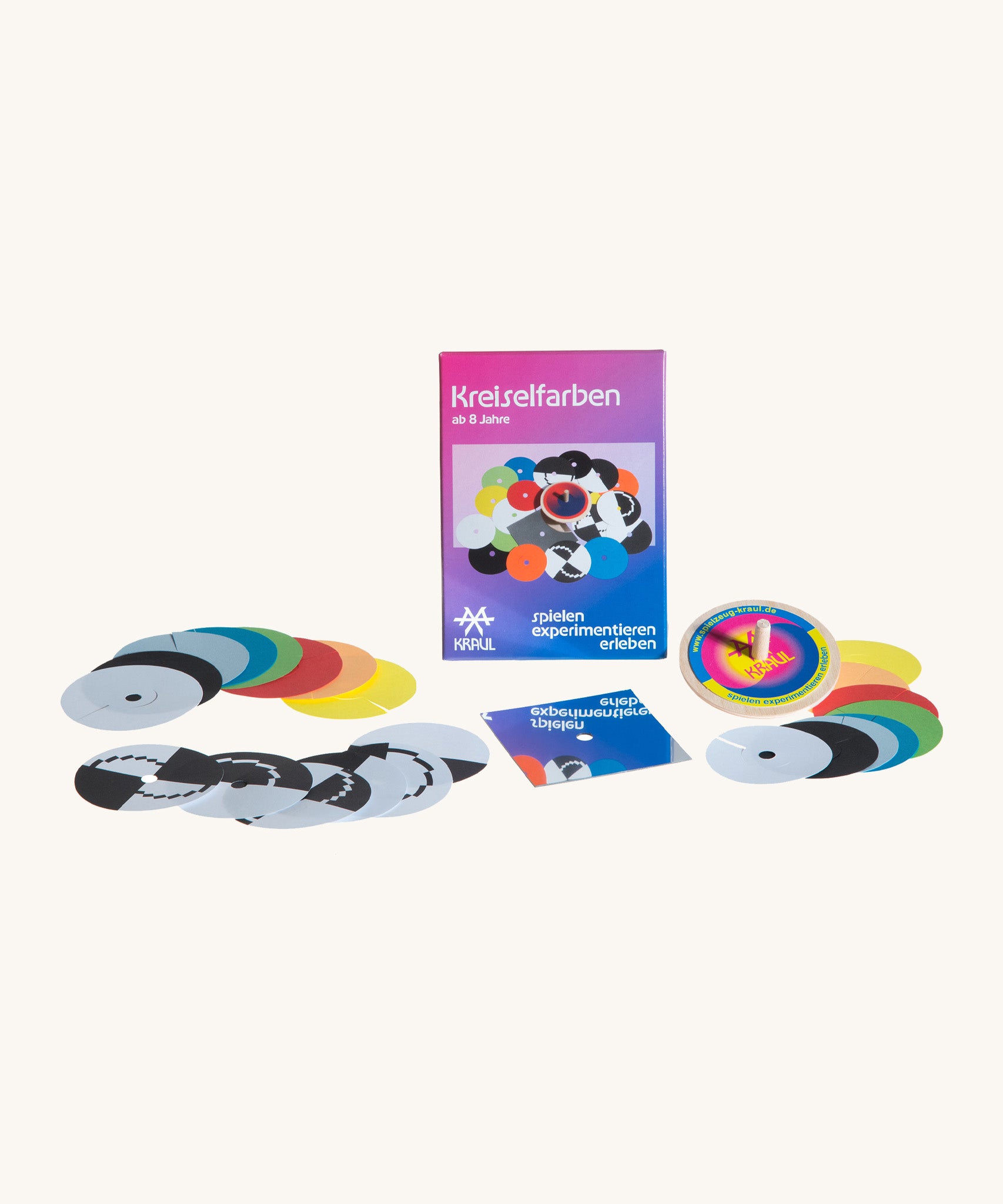 Kraul spinning top colour kit showing a wooden spinning top and different coloured disks with notches to create different visual effects