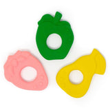 Three natural rubber baby teething toys, a yellow pear, green apple and pink strawberry on a white background.