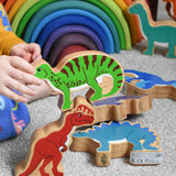 A child stacking Lanka Kade dinosuar figures. These wooden toy figures are part of a huge range of Lanka Kade fair trade, wooden toys available here at Babipur.