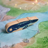 A Lanka Kade mosasurus wooden toy figure placed on a Wonderie plains of Africa play cloth. These wooden toy figures are part of a huge range of Lanka Kade fair trade, wooden toys available here at Babipur.