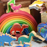A child playing with the Lanka Kade wooden dinosaur figures. These wooden toy figures are part of a huge range of Lanka Kade fair trade, wooden toys available here at Babipur.