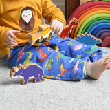 A child playing with Lanka Kade wooden toy dinosaur figures. These wooden toy figures are part of a huge range of Lanka Kade fair trade, wooden toys available here at Babipur.