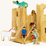 A close up of the drawbridge and lowered gate from the Lanka Kade castle set. Showing the fairytale setup including a dragon, princess, unicorn, prince and knight figure