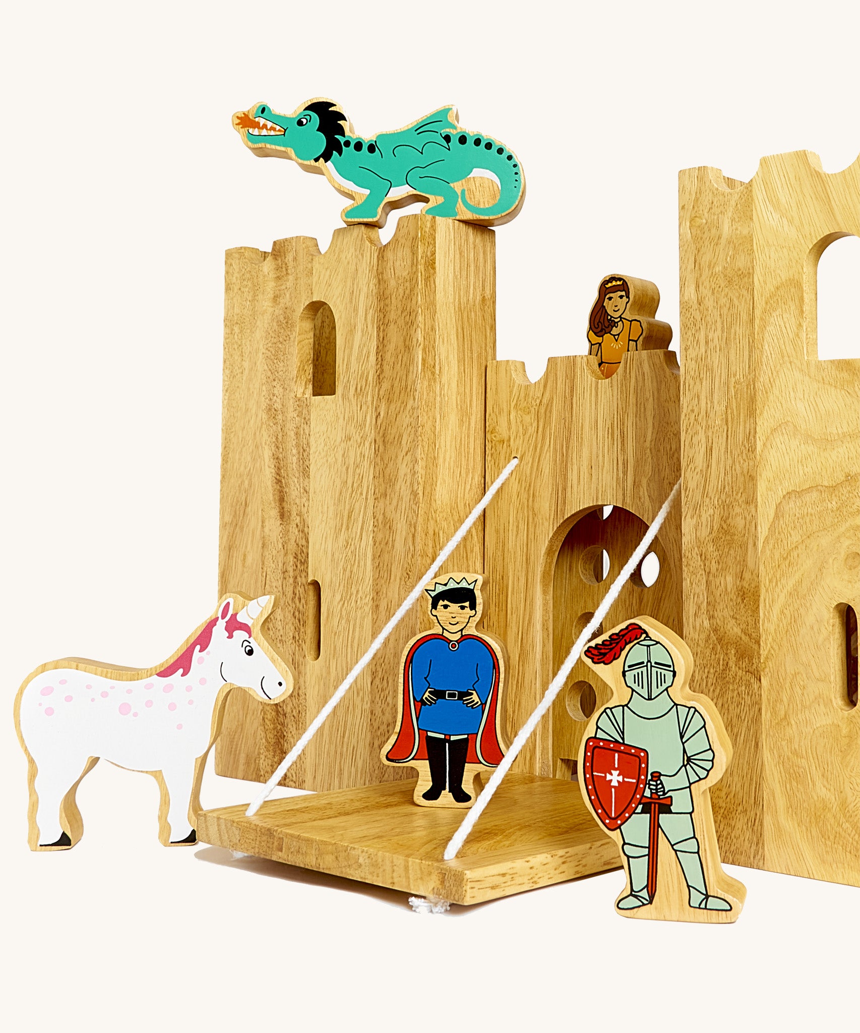 A close up of the drawbridge and lowered gate from the Lanka Kade castle set. Showing the fairytale setup including a dragon, princess, unicorn, prince and knight figure