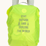 A neon green backpack cover for the Lassig kids mini outdoor backpack with a slogan saying 'stay outside and explore the world'
